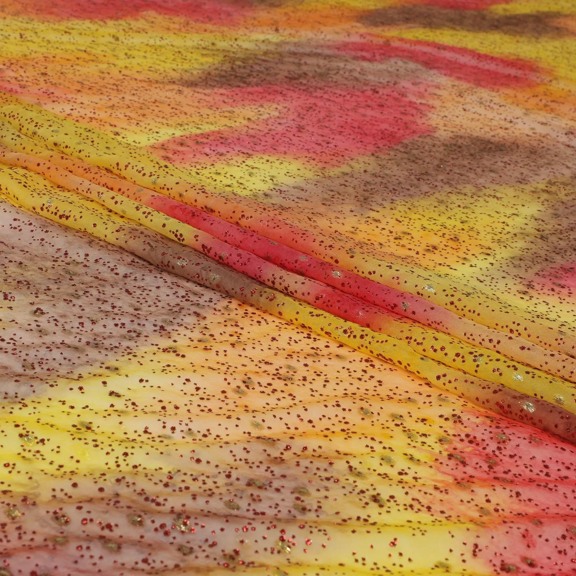 Orange, lemon yellow, ruby pink silk chiffon fabric with crimson red glitter having gold metallic lurex in fancy design